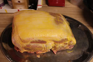Mustard applied all over meat